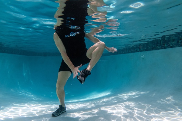 Alternating ankle reaches as part of core circuit on Poolfit, an on-demand water exercise streaming platform